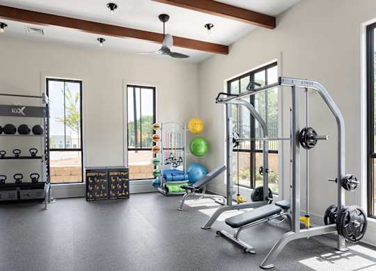 A well-equipped gym with a variety of exercise equipment.