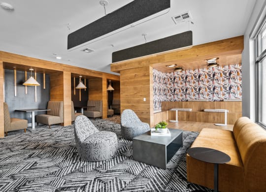 a room with a couch chairs and a coffee table