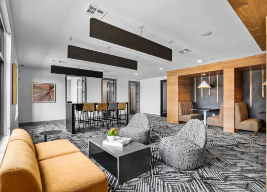 a large living room with a black and white patterned carpet