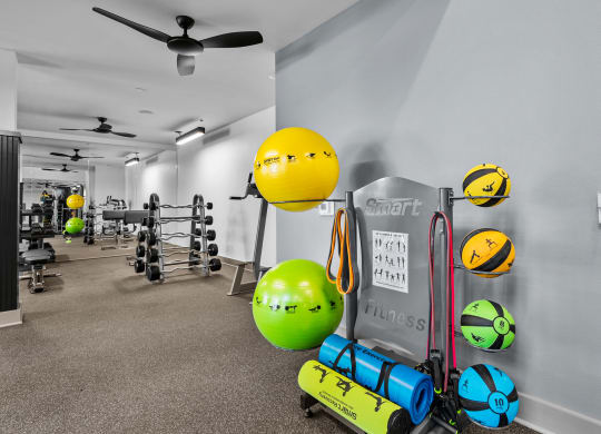 the gym at the enclave at woodbridge apartments in sugar land, tx
