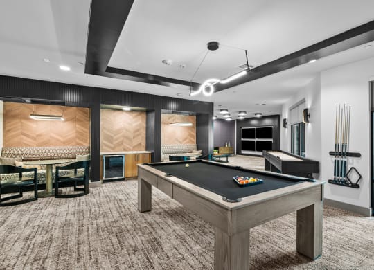 a games room with a pool table and foosball
