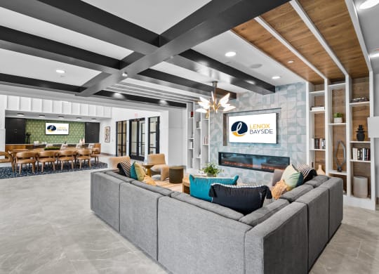a living room with couches and chairs and a fireplace