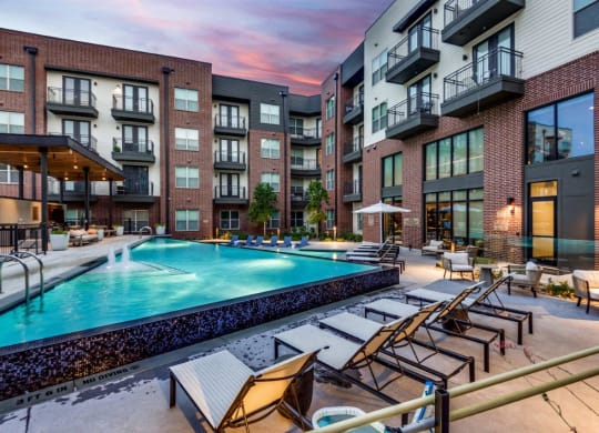 Lenox Cooper Apartments in Arlington, Texas Exterior and Pool with Lounge Chairs