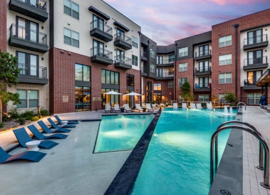 Lenox Cooper Apartments in Arlington, Texas Exterior and Pool with Lounge Chairs