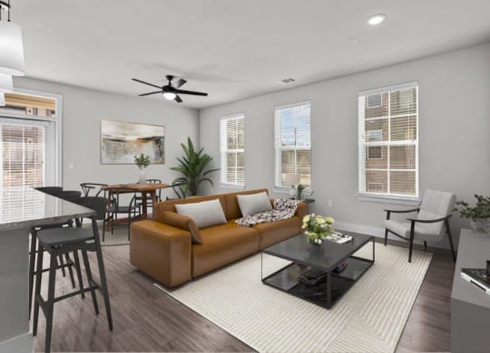a living room with a couch and a table and chairs at Lenox Grand, Texas