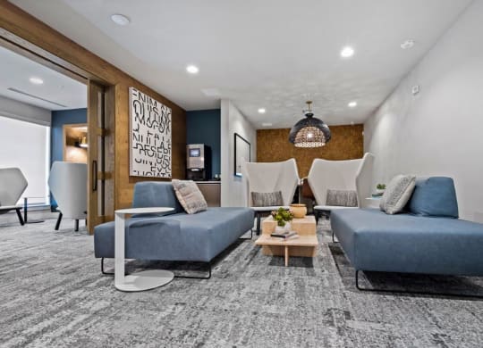 a living room with couches and chairs and a table