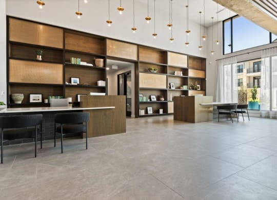 a rendering of a lobby with a desk and chairs