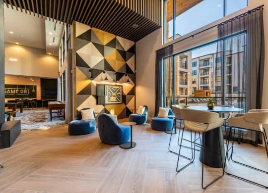 a rendering of the lobby of a hotel with a table and chairs