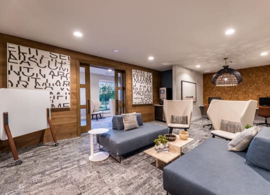 a living room with couches and chairs and a television