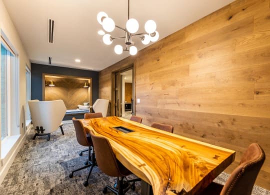 a conference room with a wooden table and chairs