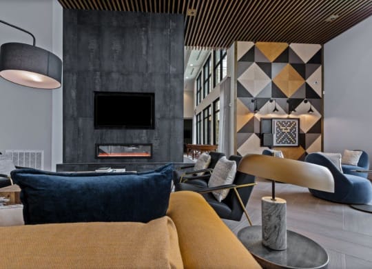 a living room with couches and chairs and a fireplace