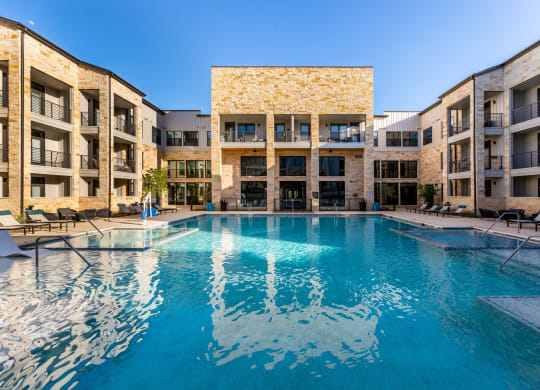 Maddox Hills Exterior and Pool with Lounge Chairs