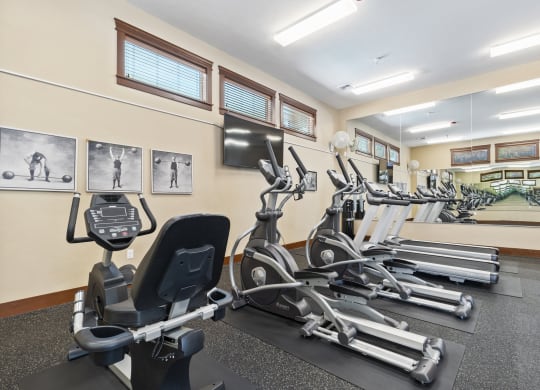 Little Tuscany Apartments & Townhomes - Fitness Room with Treadmills, Elliptical, Stationary Bikes, Mirrors