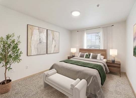 A bedroom with two beds and a plant.