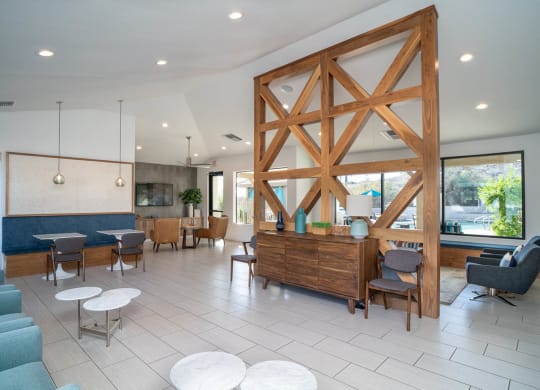 a lobby with a large wooden structure in the middle of the room