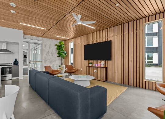 a living room with a couch and a table and a television