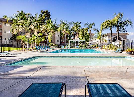 Ocean Breeze Villas Pool with Lounge Chairs
