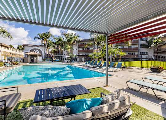 Ocean Breeze Villas Pool with Lounge Chairs