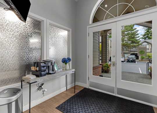 a bathroom with a sink and a glass door