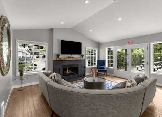 a living room with a couch and a fireplace