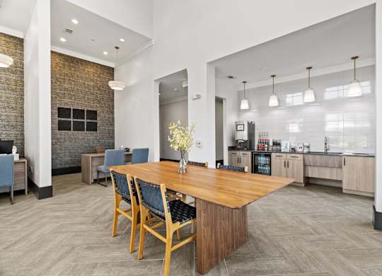 A dining room with a wooden table and chairs.