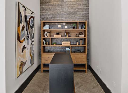 A room with a brick wall and a bookshelf.