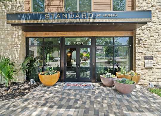 The front of a building with a sign that says