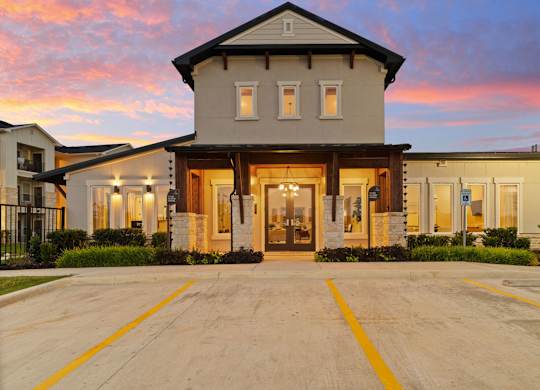 A large house with a driveway in front of it.