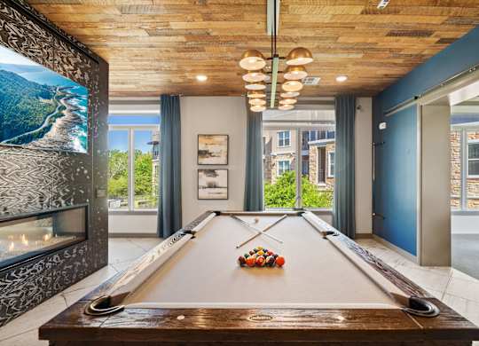 A pool table with a billiard ball on it.