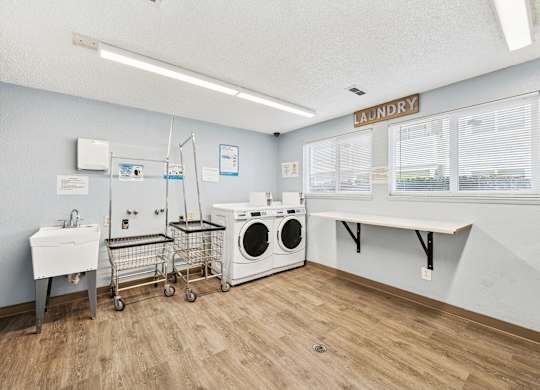 A laundry room with a washer and dryer.