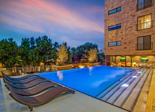 a swimming pool in front of a building