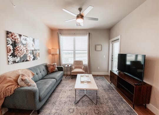 Living Room with Private Patio at Presidio at River East, Fort Worth, TX