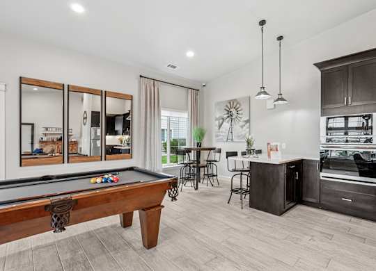 Remington Village Apartments in Gillette, Wyoming Clubhouse Lounge with Kitchen and Pool Table