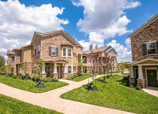 A row of houses with a walkway between them.