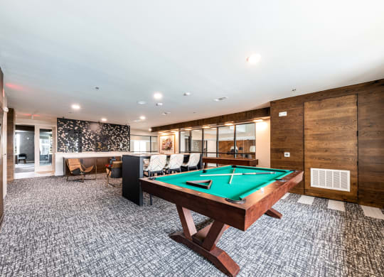 Lenox SoCo Apartments  spacious game room with a pool table