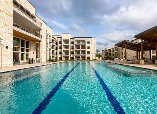 Lenox SoCo Apartments large swimming pool with apartments in the background