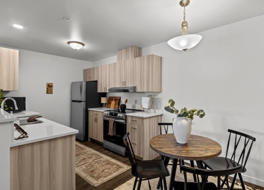 The Banks on Bradley Apartments in Richland, Washington Model Kitchen and Dining Area