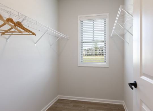 A room with a window and a door.