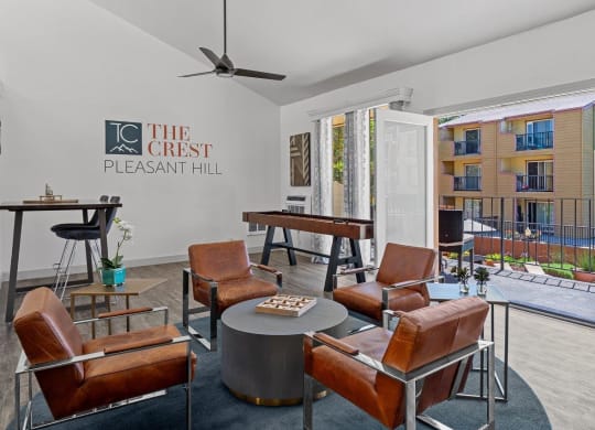 The Crest Pleasant Hill Apartments in California Clubhouse Lounge with Shuffleboard and Patio