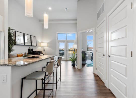 The Edison at Bozeman Gateway Apartments in Bozeman, Montana Model Kitchen and View into Living Room and Bedroom