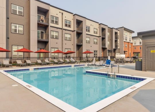 The Edison at Bozeman Gateway Apartments in Bozeman, Montana Pool with Lounge Chairs