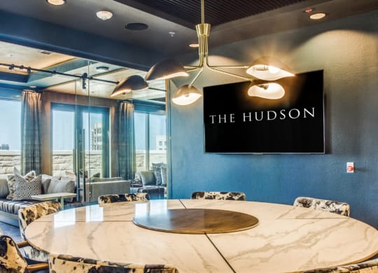 the hudson meeting room with a round table and chairs