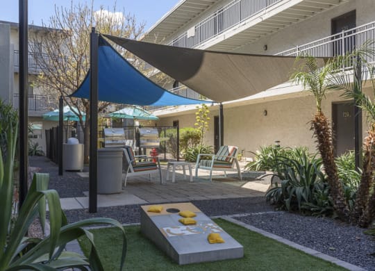 The Icon on Central Apartments in Phoenix, Arizona Patio with BBQ's and Corn Hole