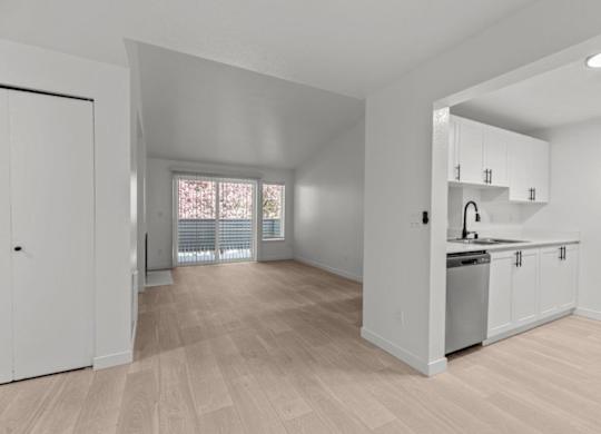 The Marina at Martha Lake Apartments in Bothell, WA Kitchen and View into Living Room