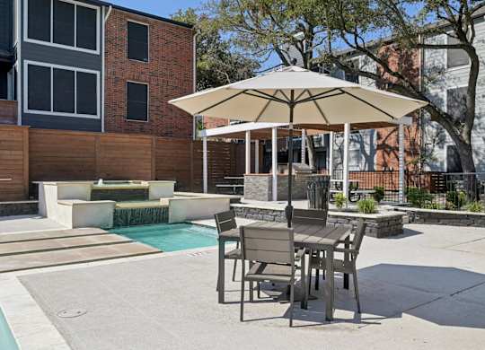 The Monet Apartments in Dallas, Texas Pool and Patio with Seating