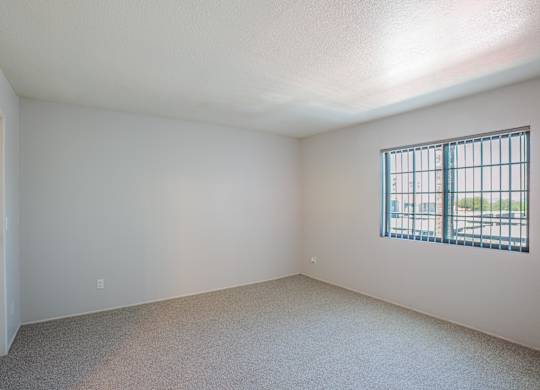 A room with a window and a door.