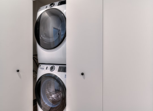 a washing machine and dryer in a laundry closet
