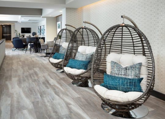 a group of chairs sitting on top of a hard wood floor