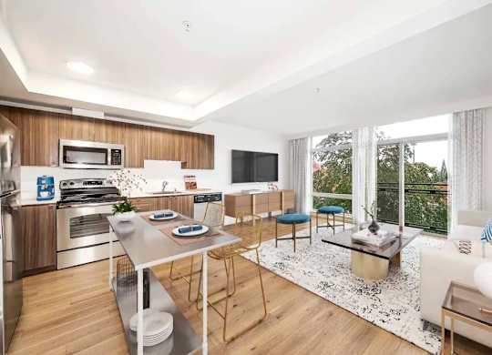 A modern kitchen with a dining table and chairs.