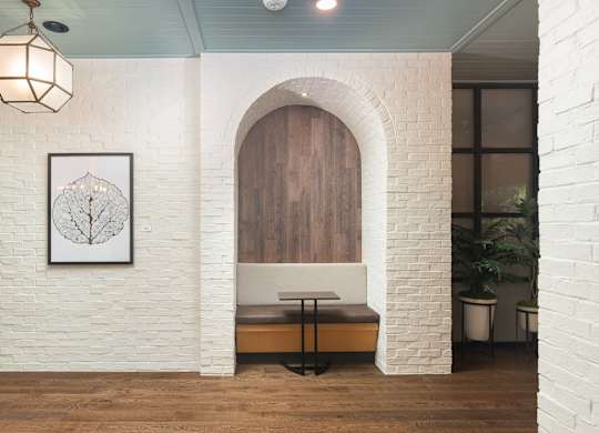 Private arched brick study area with small table and seating at Sylvan Uptown, Colorado, 80203